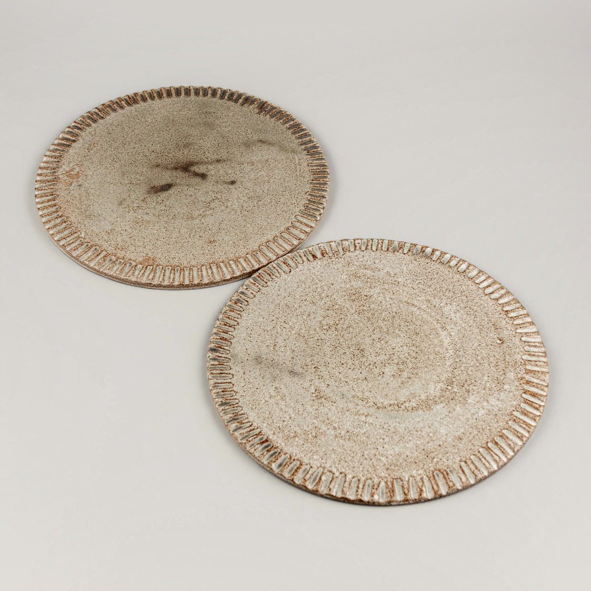 Minimal small ceramic plate for dessert, handmade with artistic flair.
