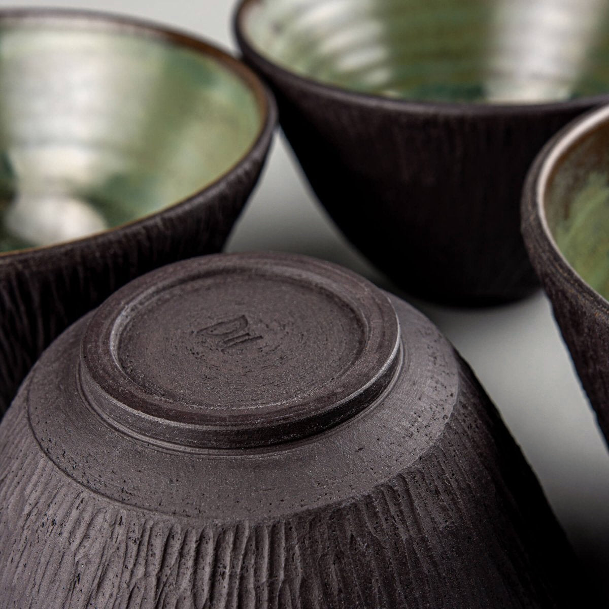 Chef-grade handmade ceramic bowl with smooth glaze and raw textured exterior.