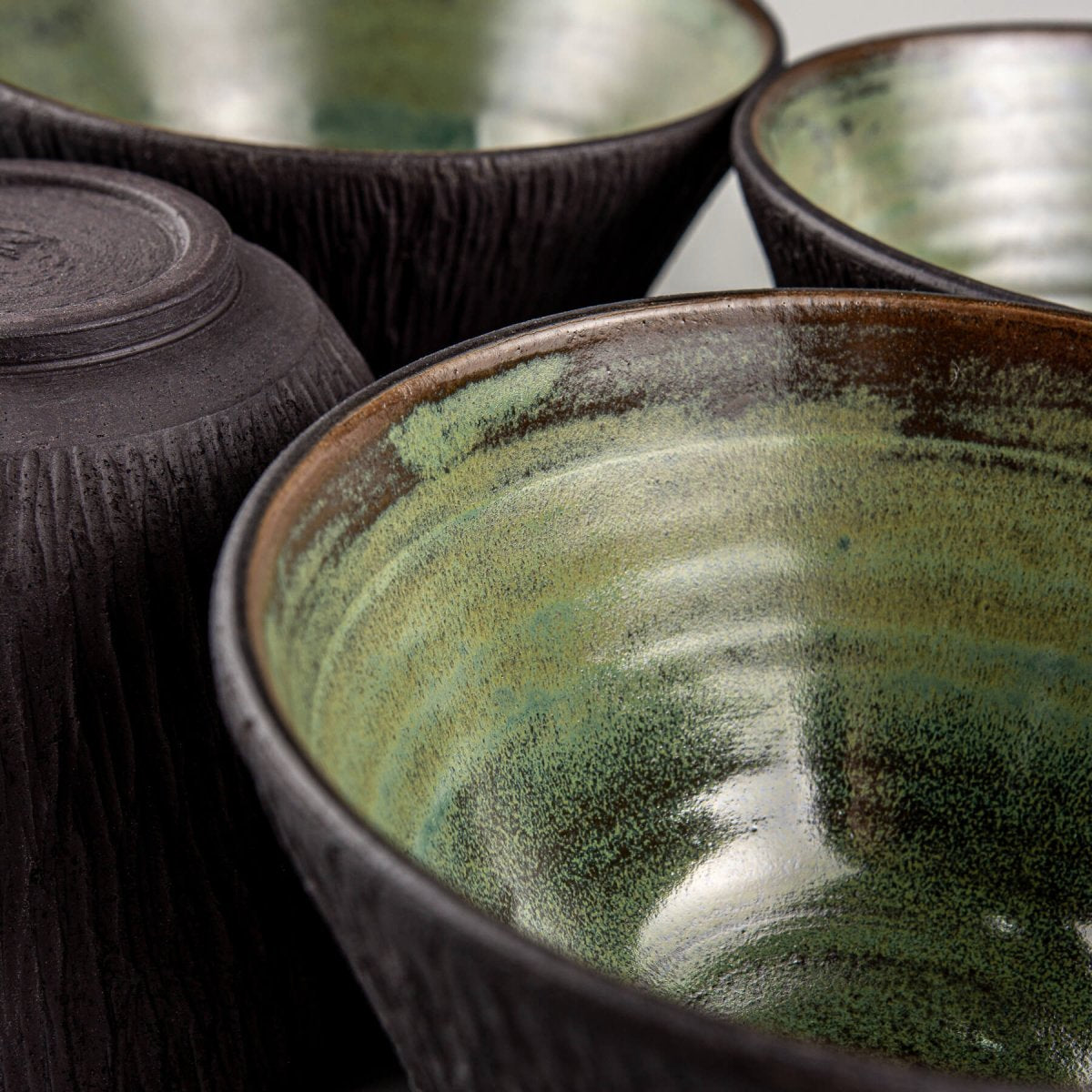Handcrafted green-glazed bowl ideal for culinary presentation and luxury gift ideas.