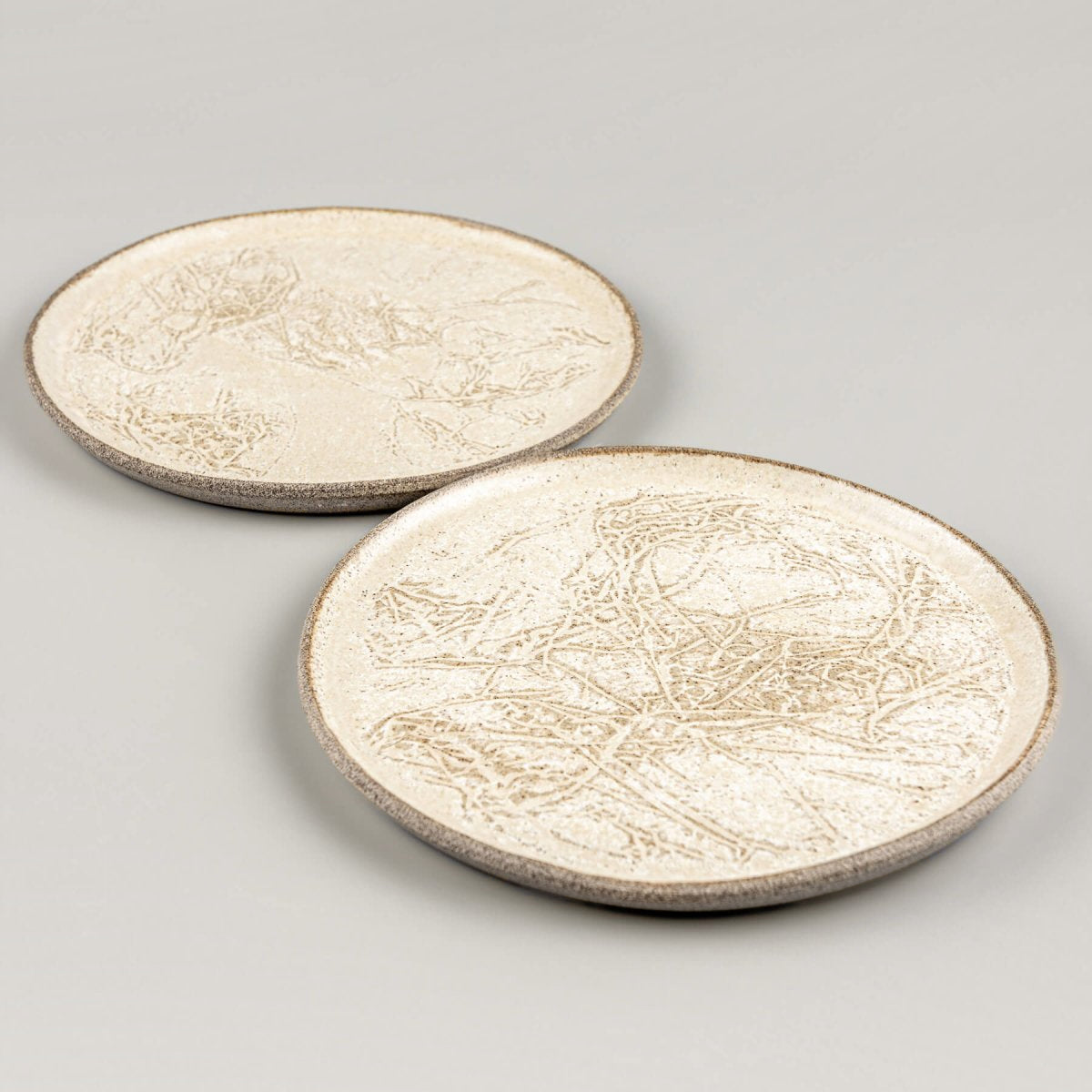 Minimalist plate set designed for dessert or small-course serving.