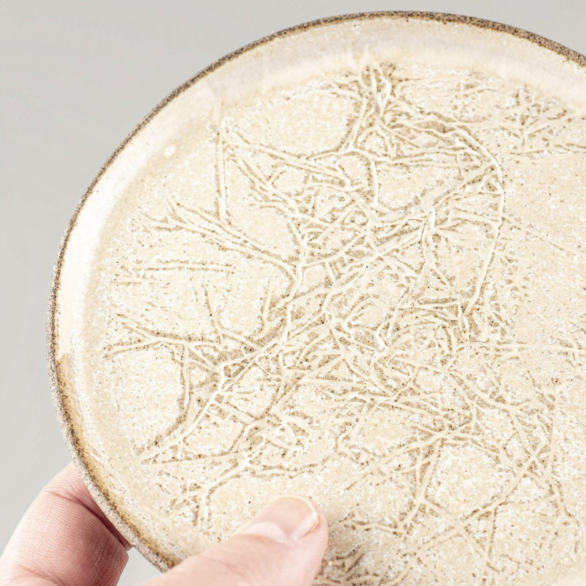 Elegant edge detailing on ceramic plate for refined interior design.