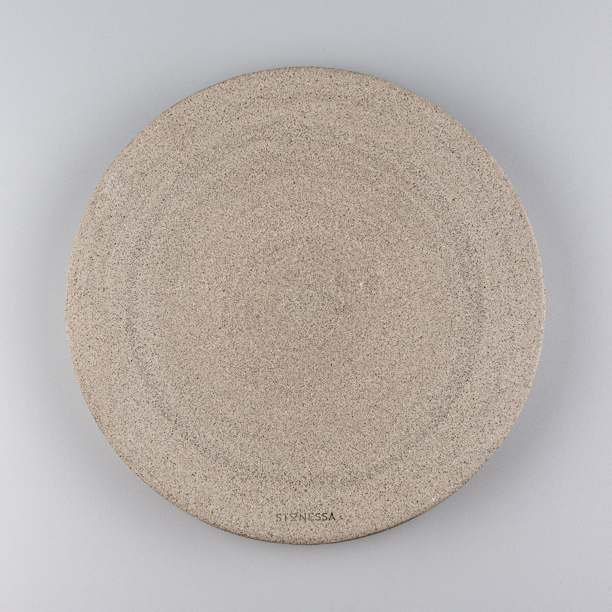 Flat round plate with handmade texture and gray glaze, perfect gift idea for food lovers.