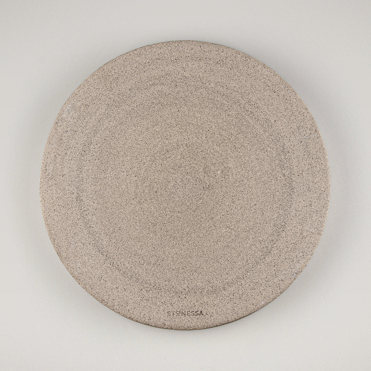 Flat round plate with handmade texture and gray glaze, perfect gift idea for food lovers.