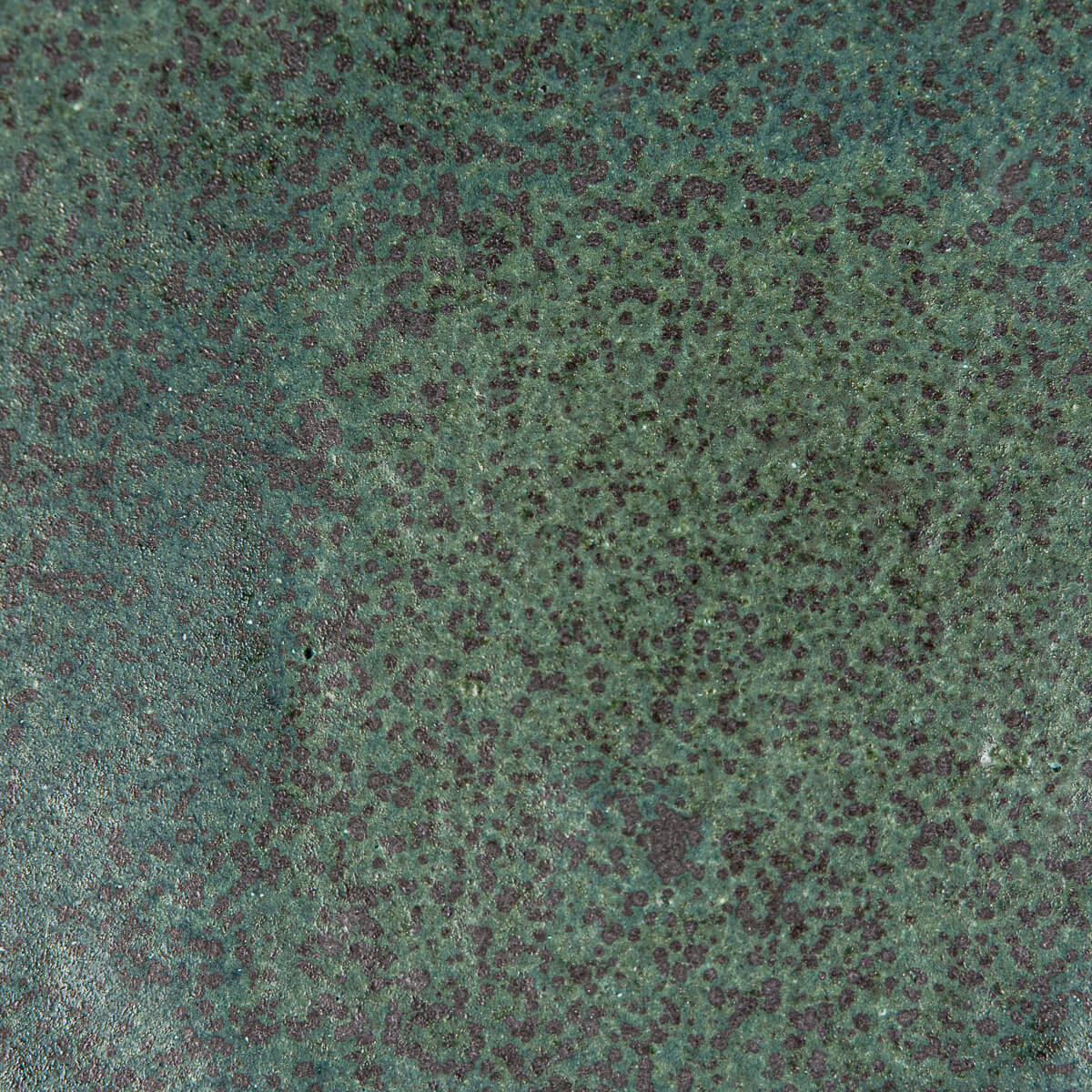 Macro view of textured handmade glaze suitable for luxury tableware and design lovers.