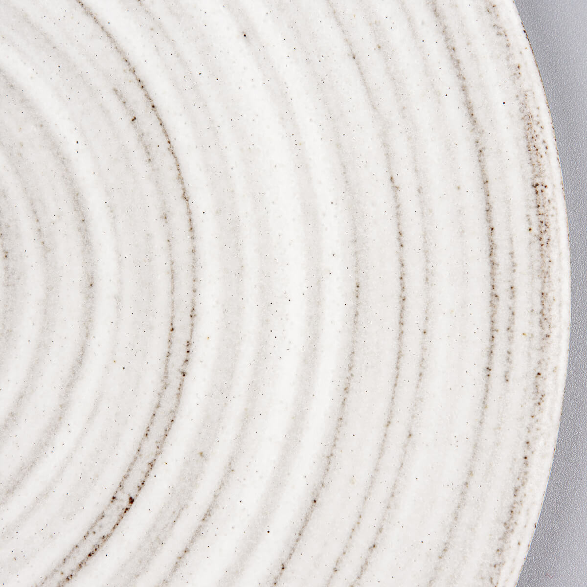 Modern handcrafted ceramic plate designed for fine dining table presentations.