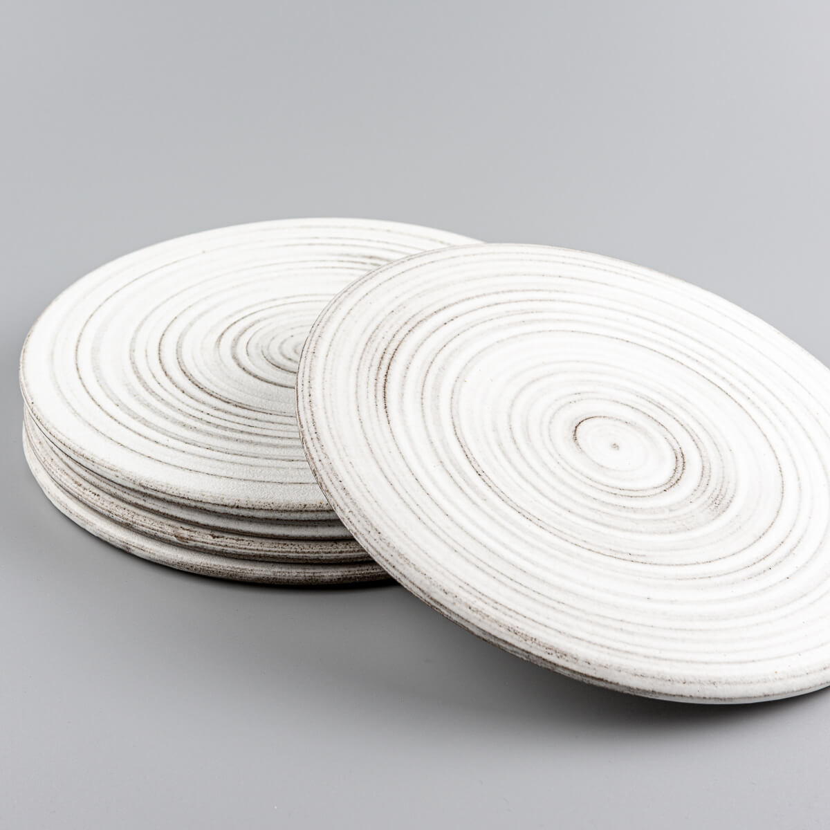Elegant handmade ceramic plates perfect for boutique hotels and curated tables.