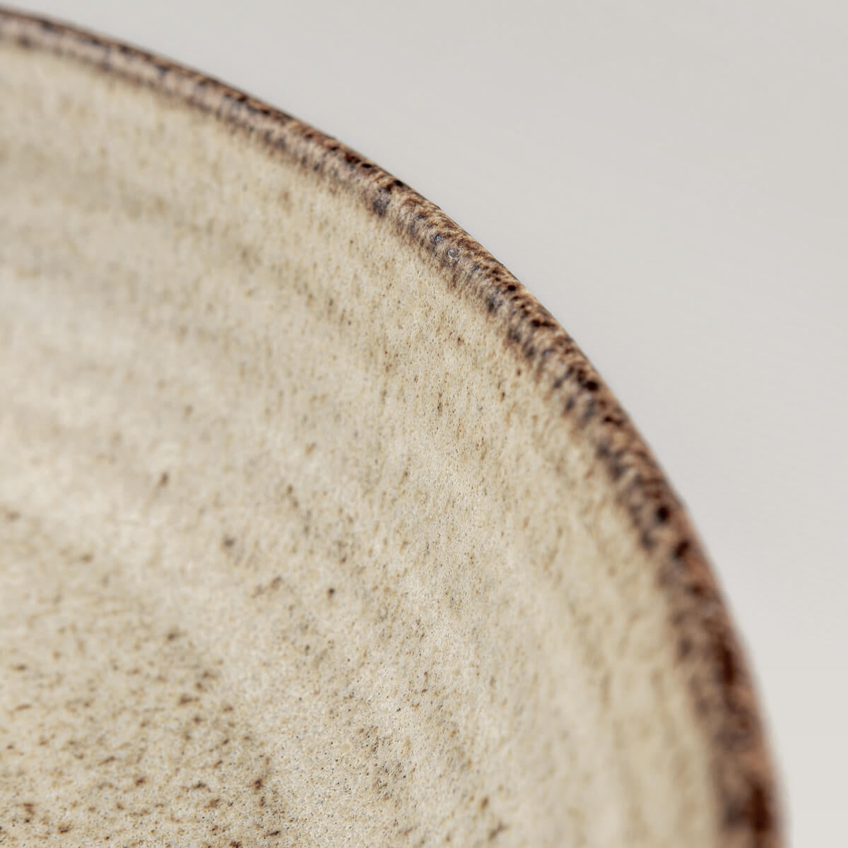 Organic handmade plate with curved coupe form and durable fine dining finish.