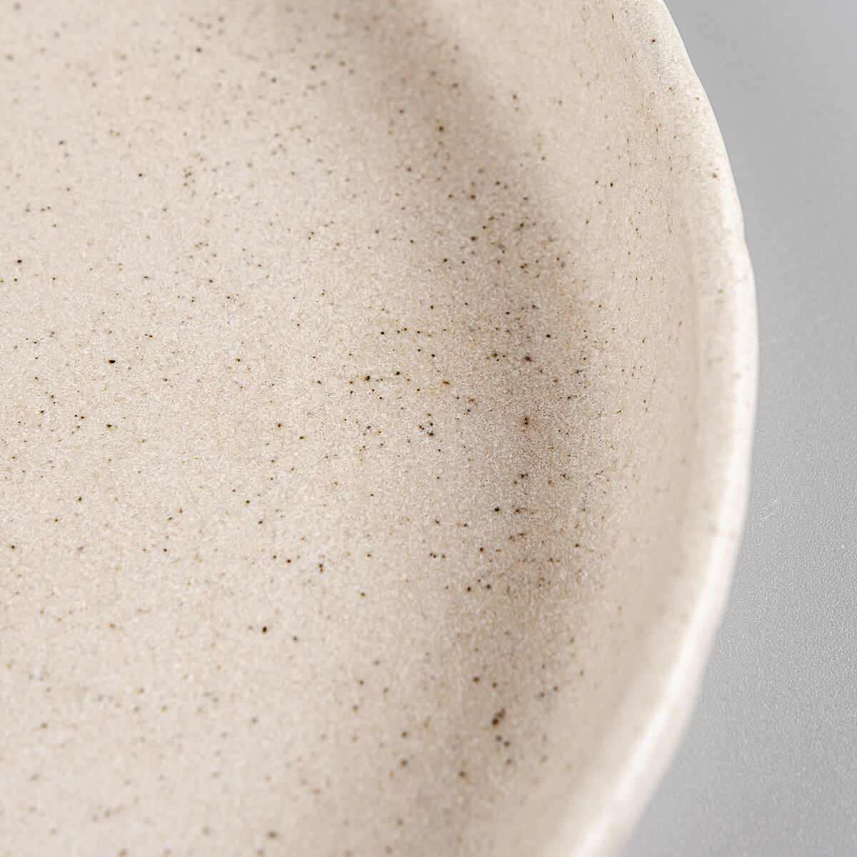 Organic beige clay plate for dessert, collectible tableware for gifting.