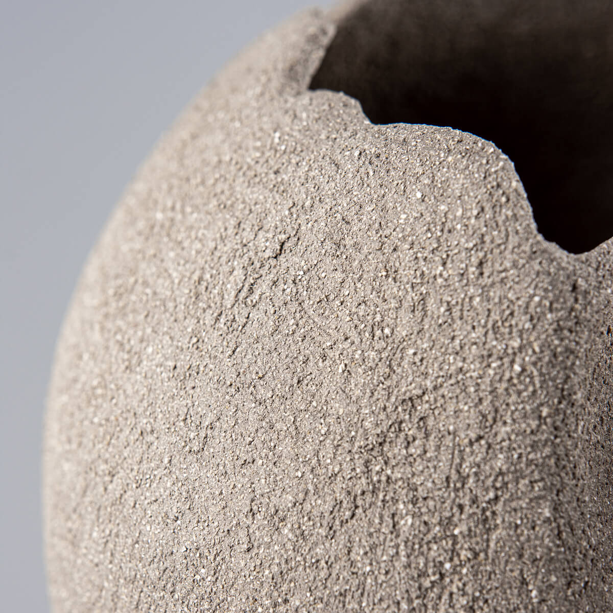 Artistic stoneware pottery vase for boutique hotel and modern interior design.