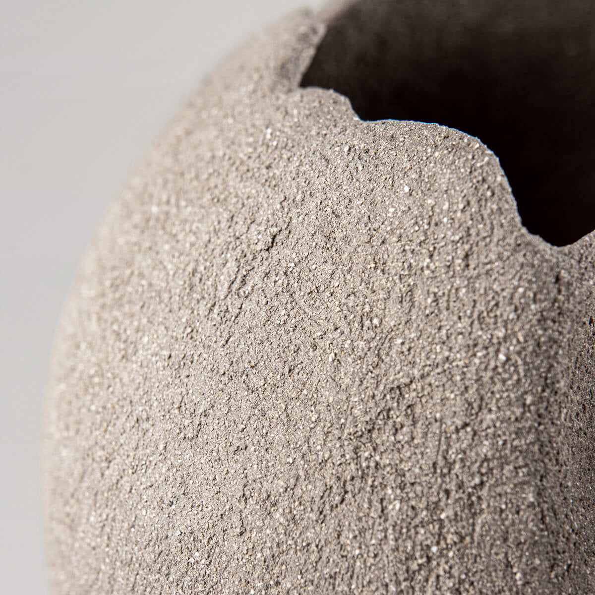 Artistic stoneware pottery vase for boutique hotel and modern interior design.