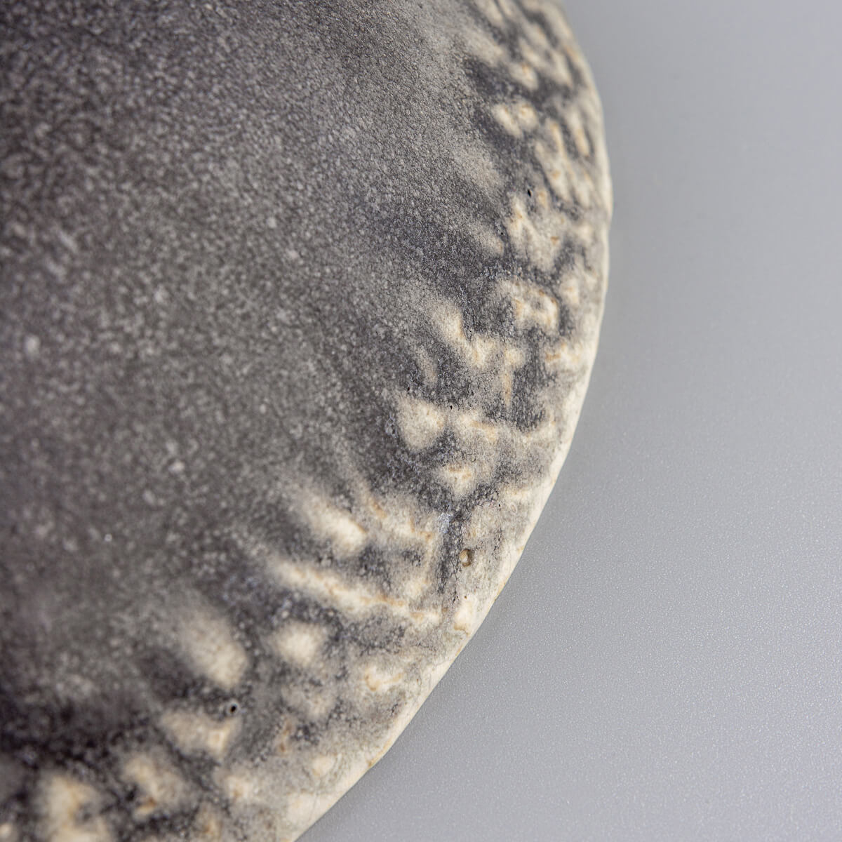 Organic glaze finish on handcrafted bowl showing stoneware craftsmanship.
