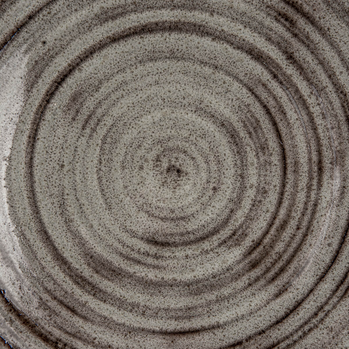 Textured black stoneware base left unglazed to showcase natural clay elegance.