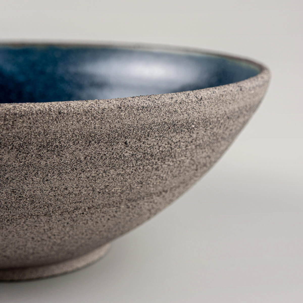 Side profile emphasizing balance and shape of handcrafted stoneware bowl.