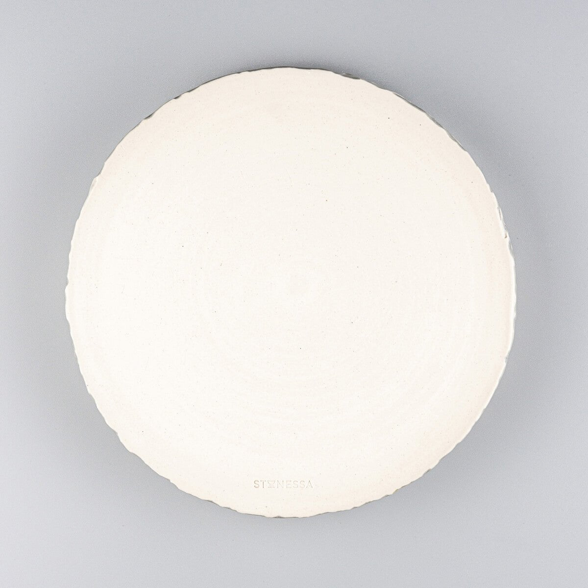 Unique stoneware plate for chefs and collectors with artisanal craftsmanship and elegant glaze.