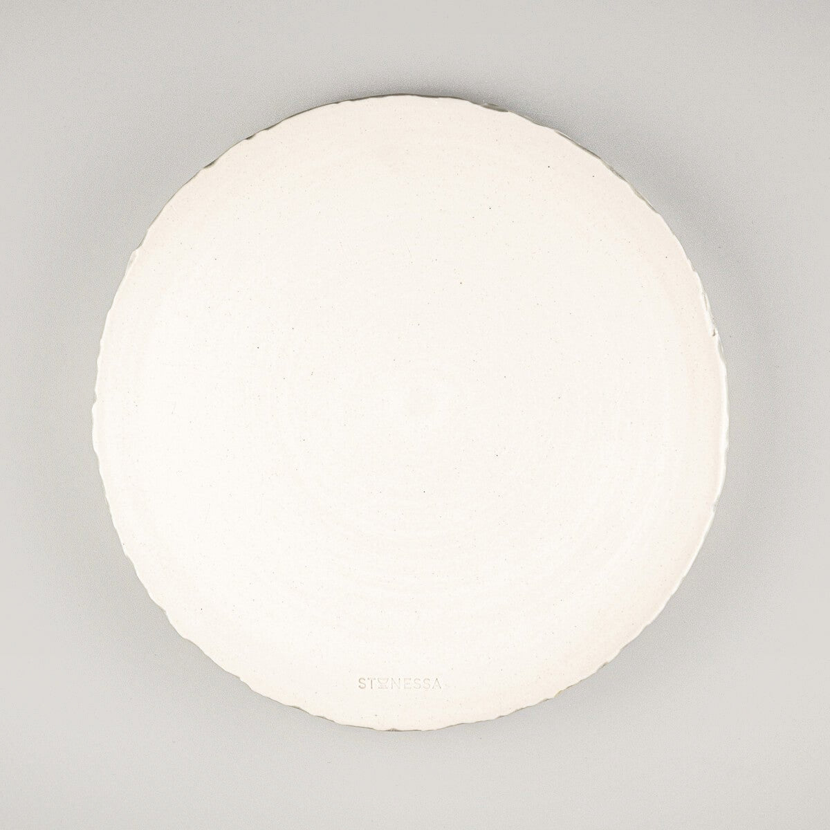 Unique stoneware plate for chefs and collectors with artisanal craftsmanship and elegant glaze.
