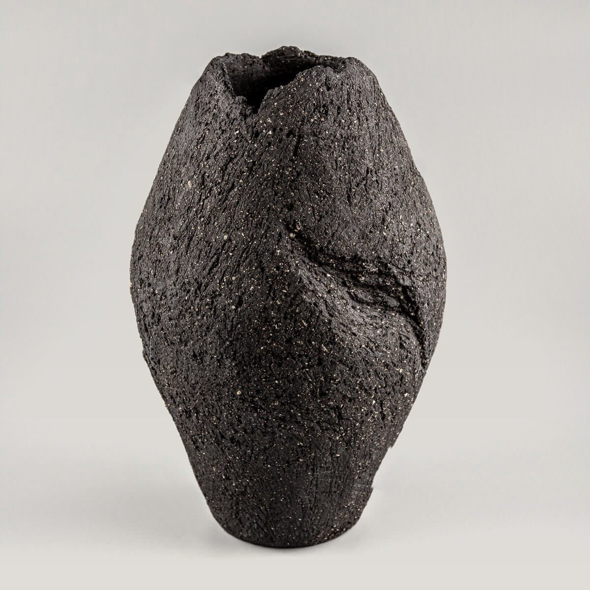 Luxury pottery vase handmade with dark stoneware clay for interior design and collectible pottery.
