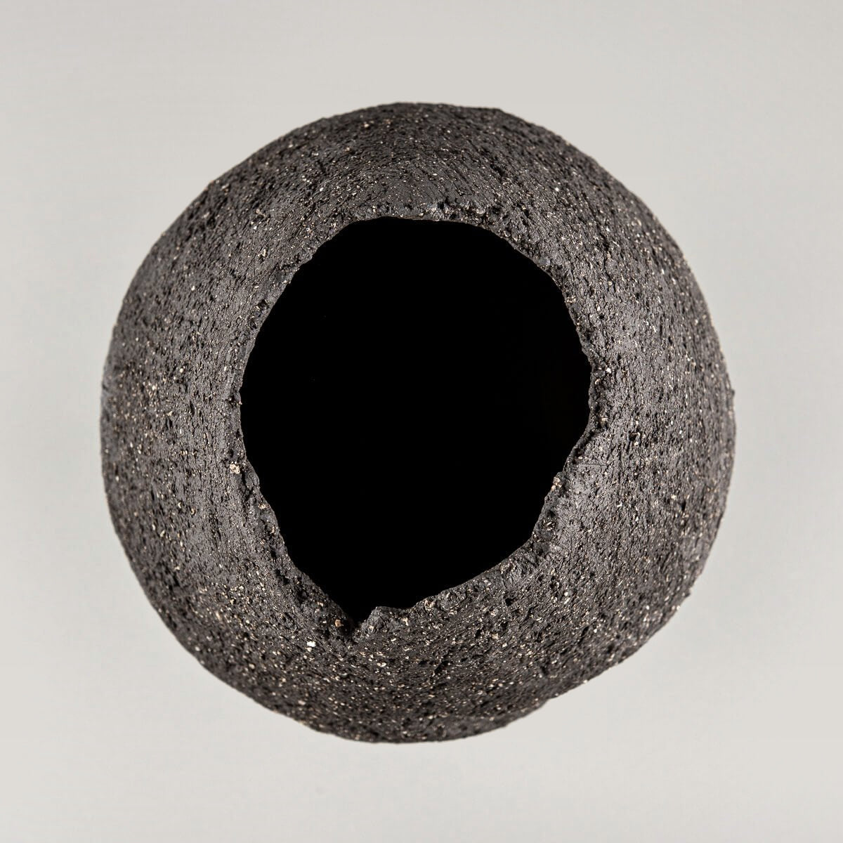 Handmade pottery vase with a narrow base and textured stoneware surface for a wedding gift.