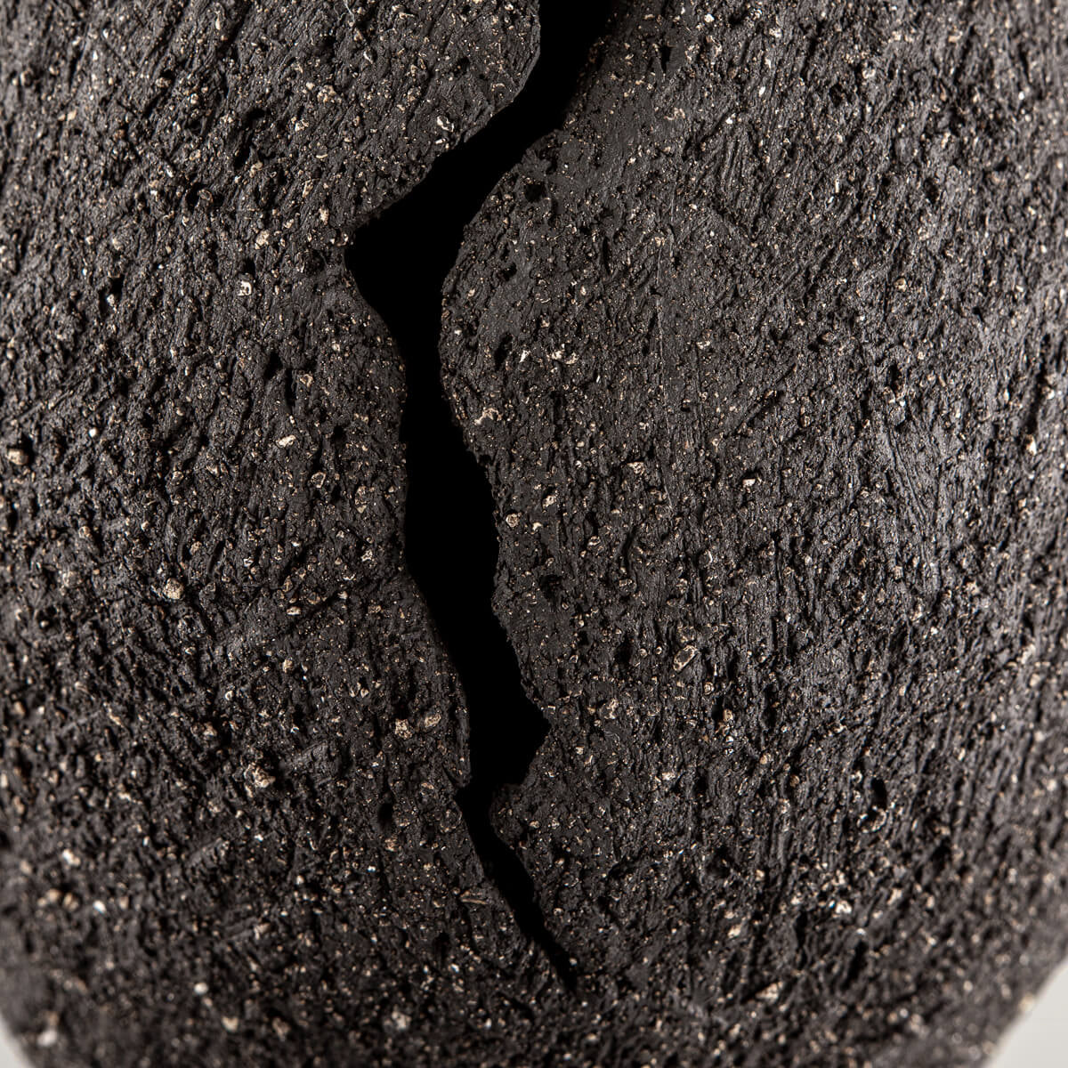 Organic handmade decor piece crafted from textured stoneware clay for exclusive spaces.