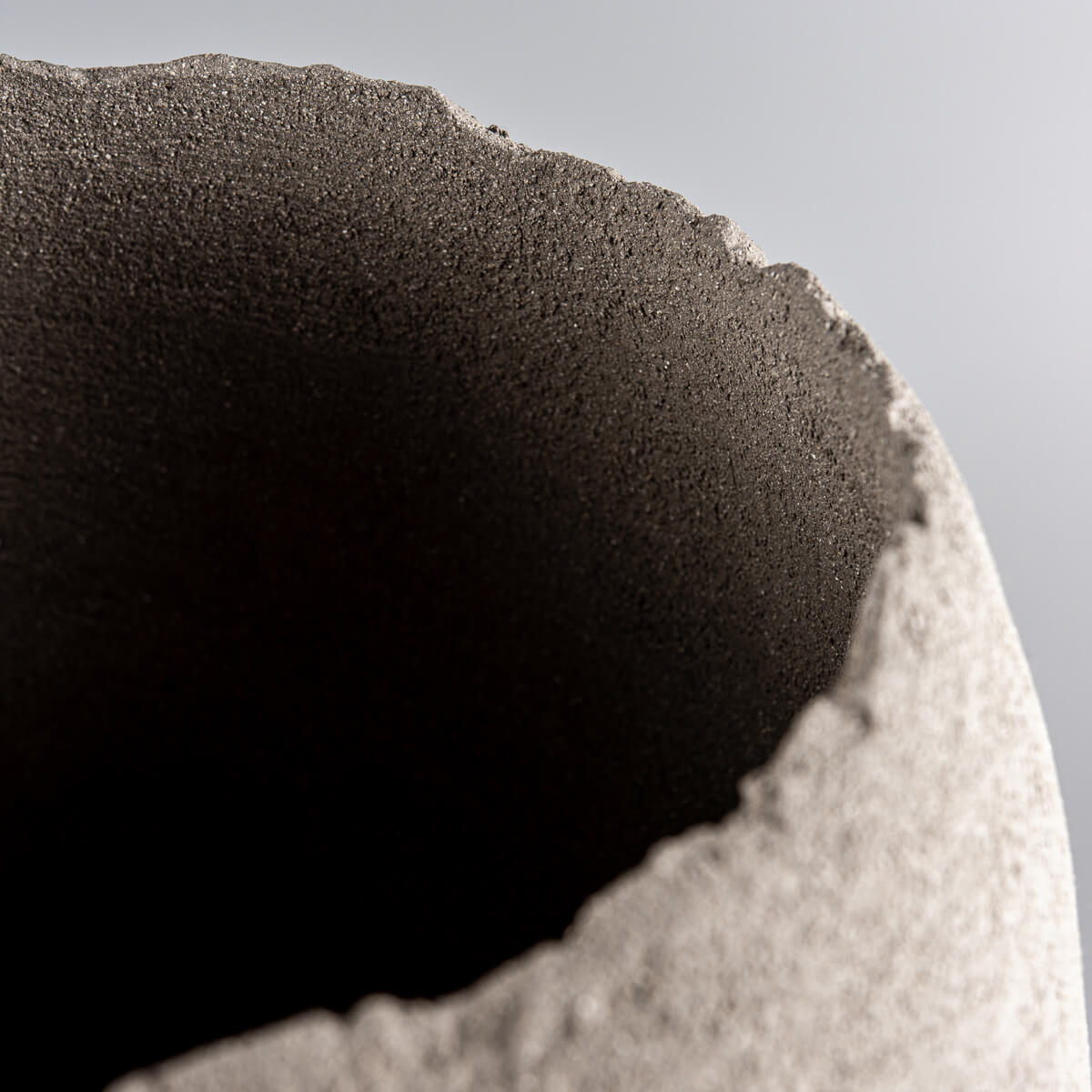 Elegant handmade vases with curved stoneware bodies for interior design.