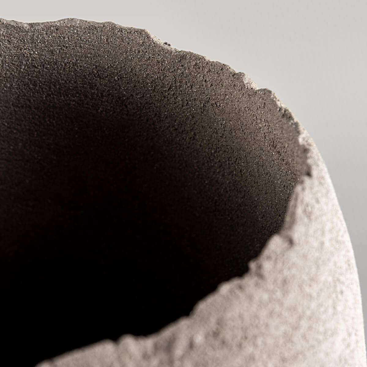 Elegant handmade vases with curved stoneware bodies for interior design.