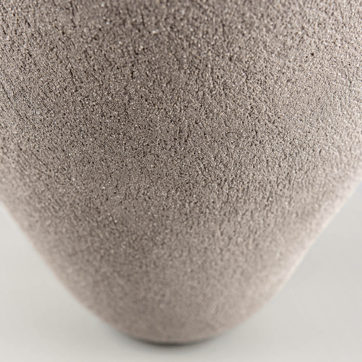 Organic handmade vases with natural clay texture for private collectors.