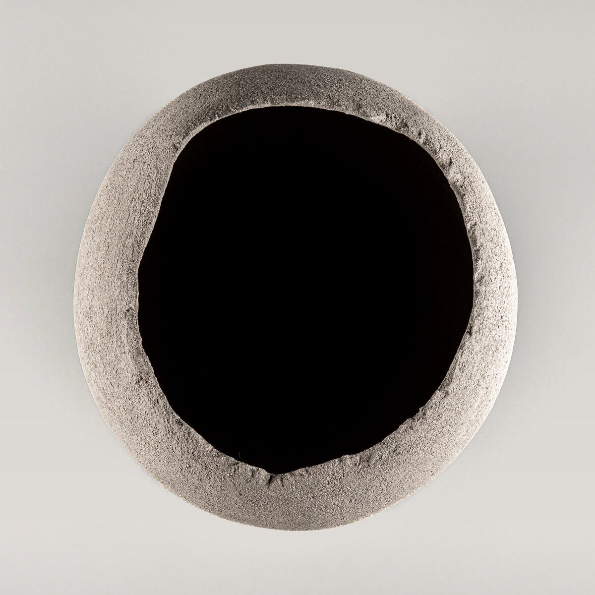 Minimalist handmade vases with organic, unglazed clay interior.