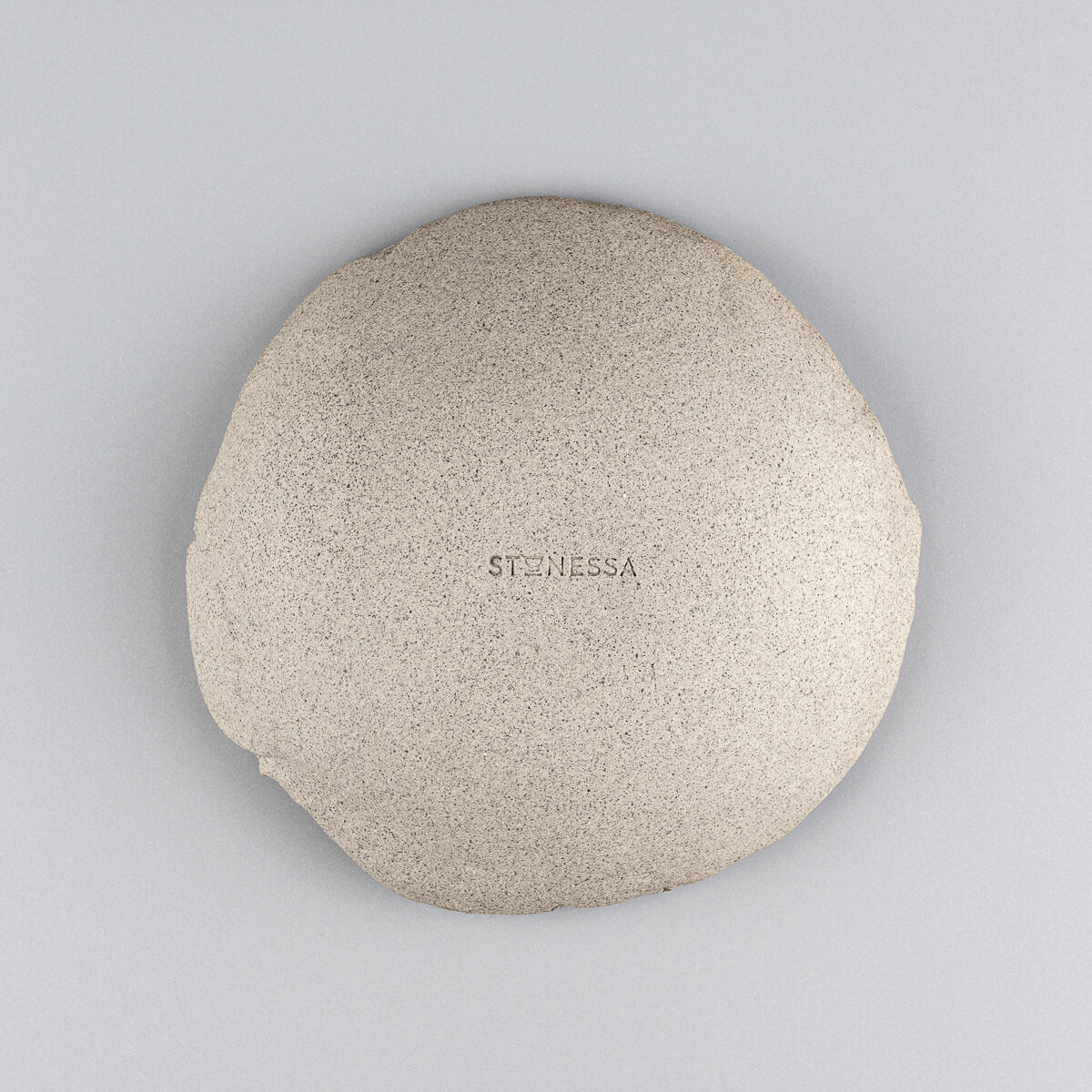 Underside of artisanal stoneware sushi plate showing raw clay finish.