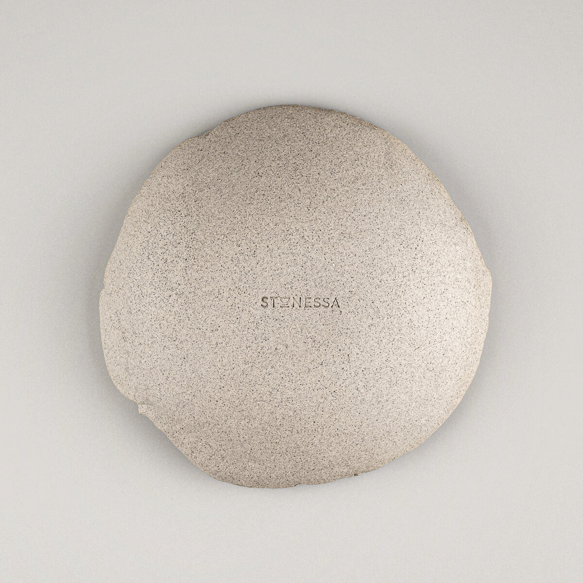 Underside of artisanal stoneware sushi plate showing raw clay finish.