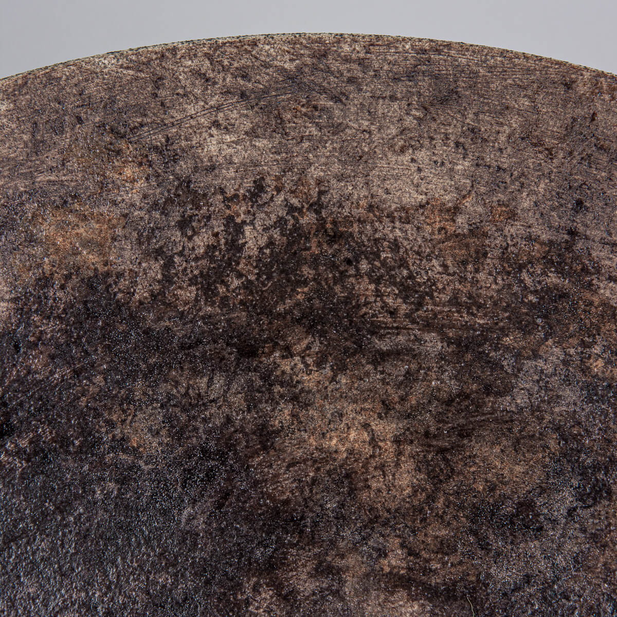 Detailed texture of glazed interior on artisanal stoneware plate.