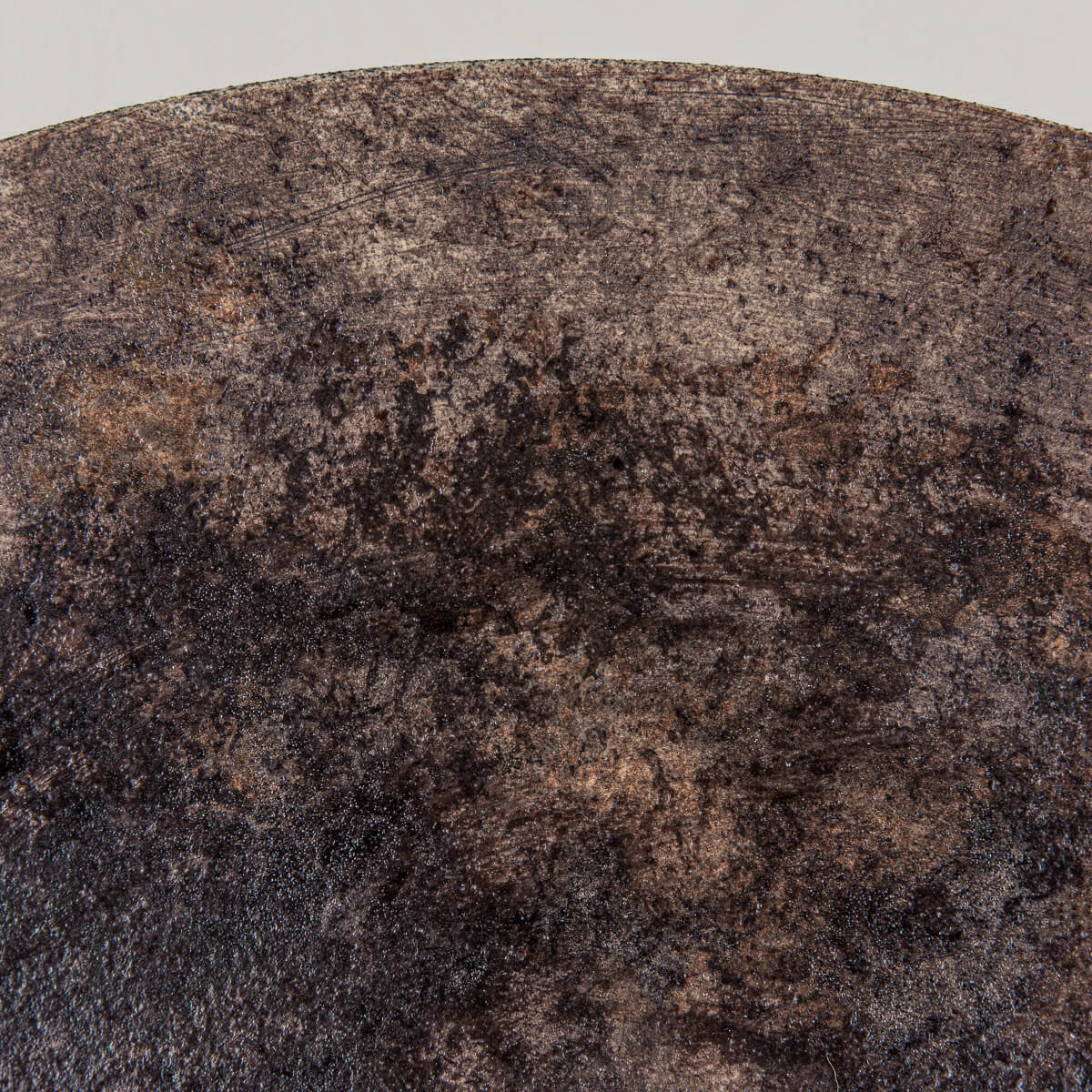 Detailed texture of glazed interior on artisanal stoneware plate.