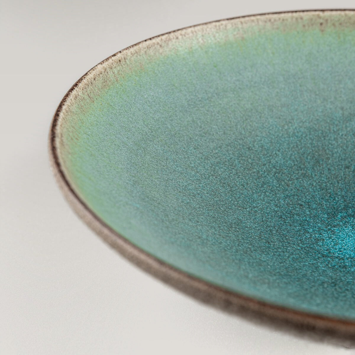 Rustic yet refined handmade ceramic plate for luxury culinary presentation.