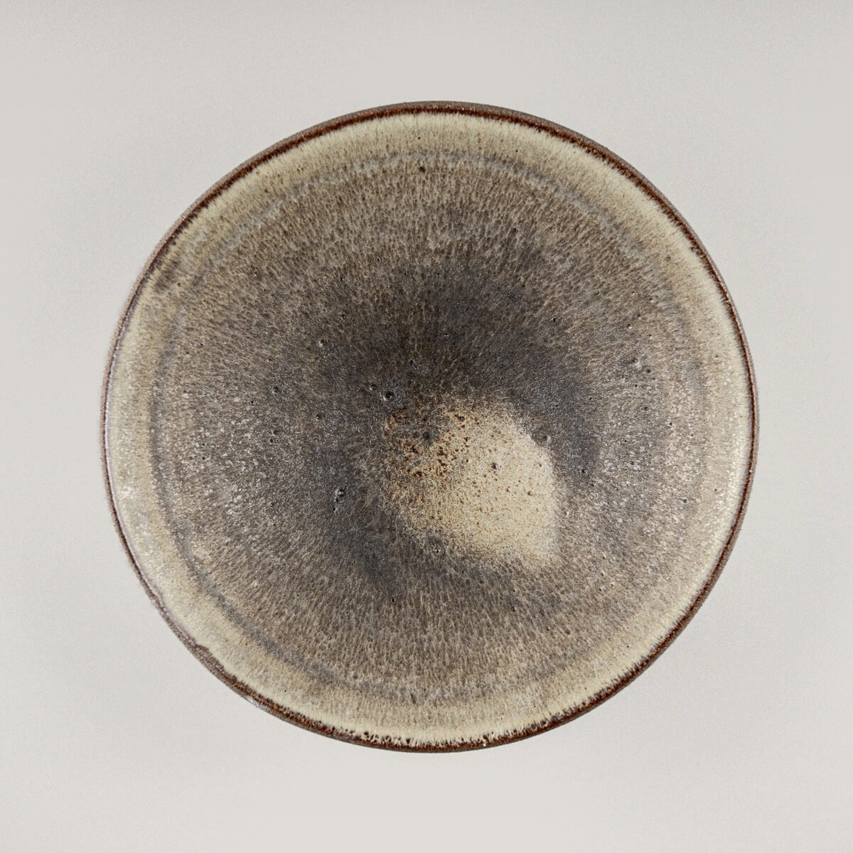 Elegant ceramic dinner plate with matte olive-green glaze, perfect for fine dining restaurants.