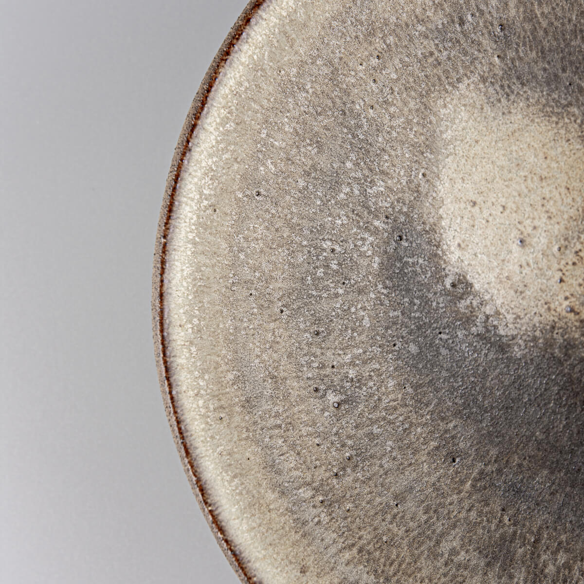 Textured ceramic dinner plate with handcrafted matte olive-green finish for chefs.