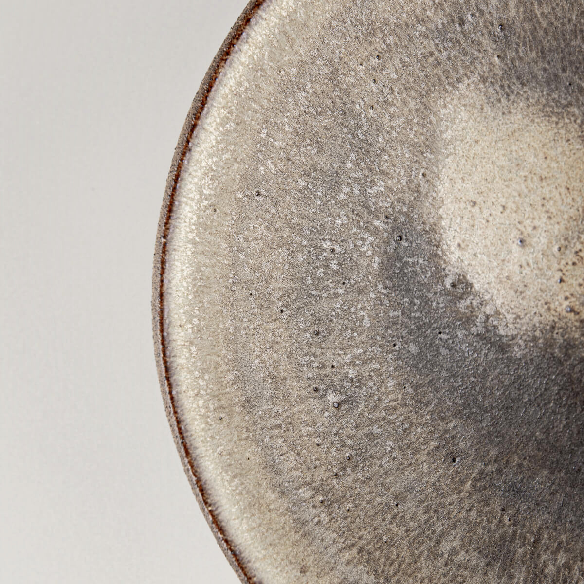 Textured ceramic dinner plate with handcrafted matte olive-green finish for chefs.