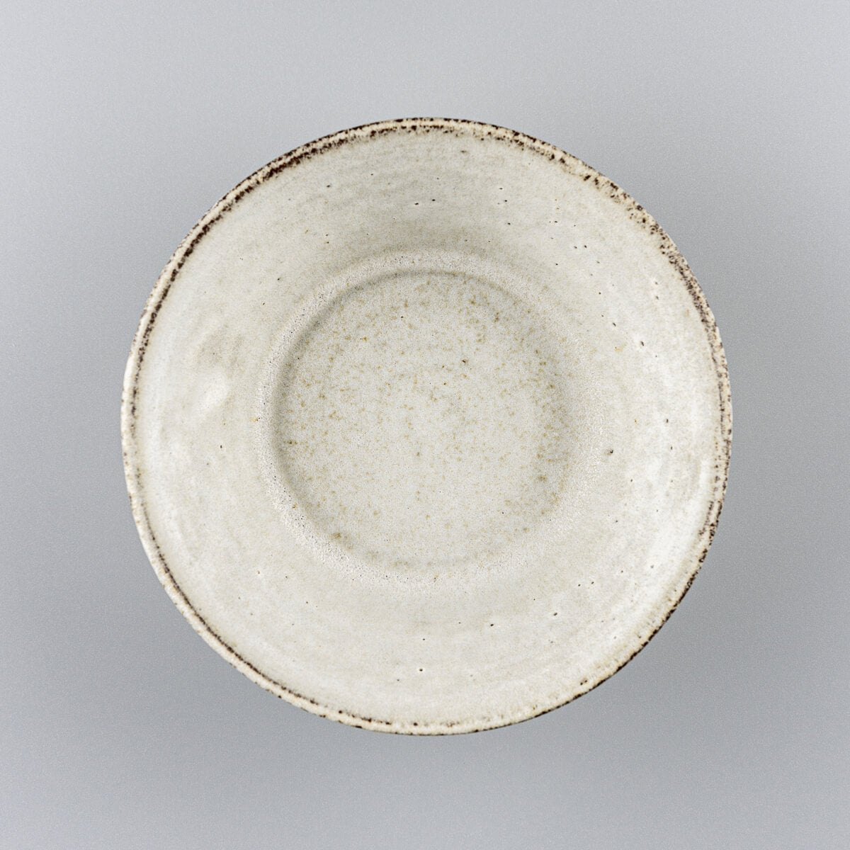 Top view of handcrafted pottery bowl showing wide rim and soft glazed interior.
