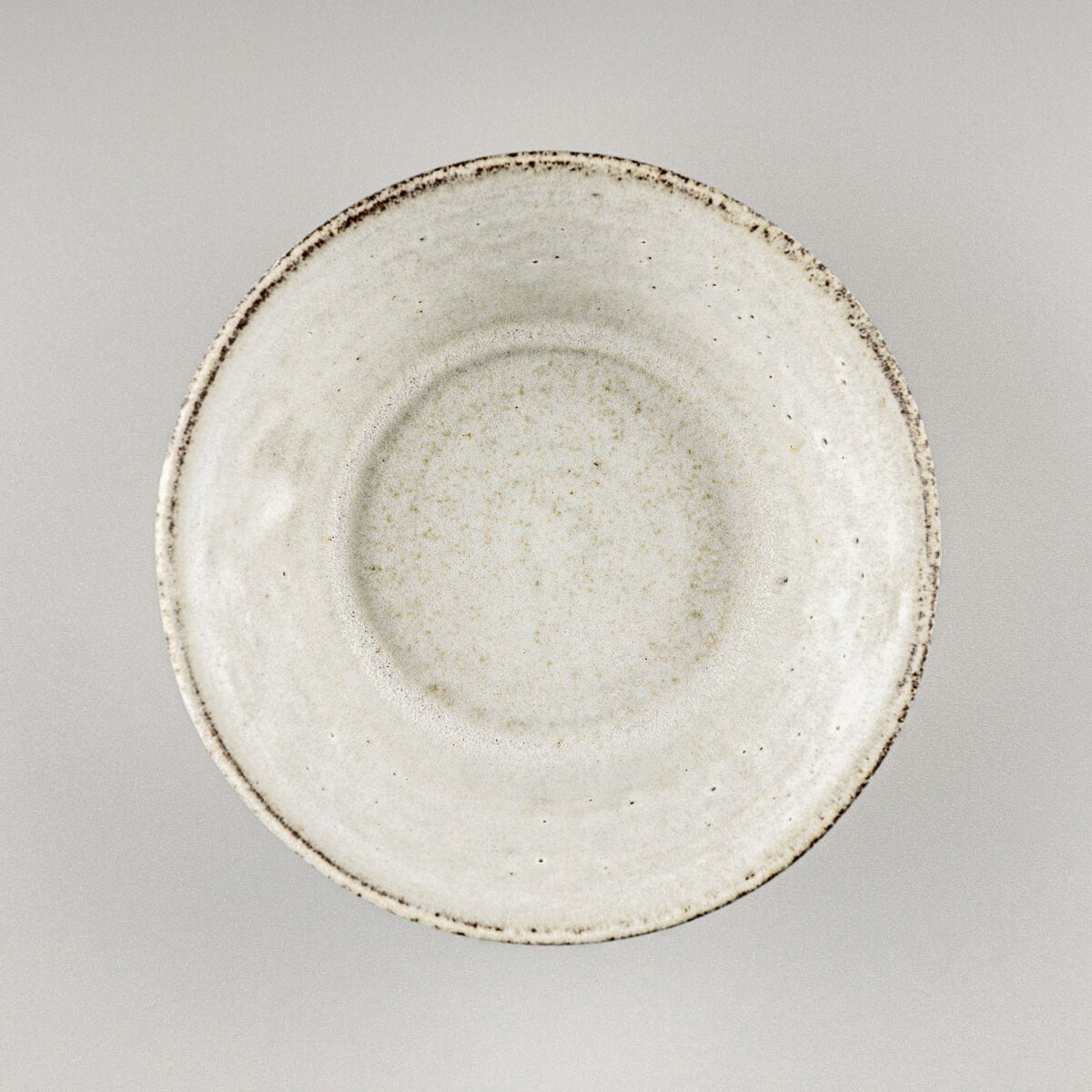 Top view of handcrafted pottery bowl showing wide rim and soft glazed interior.