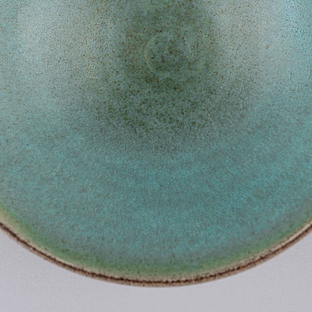 Zoom-in of rim and inner glaze showing subtle transitions of blue and green.