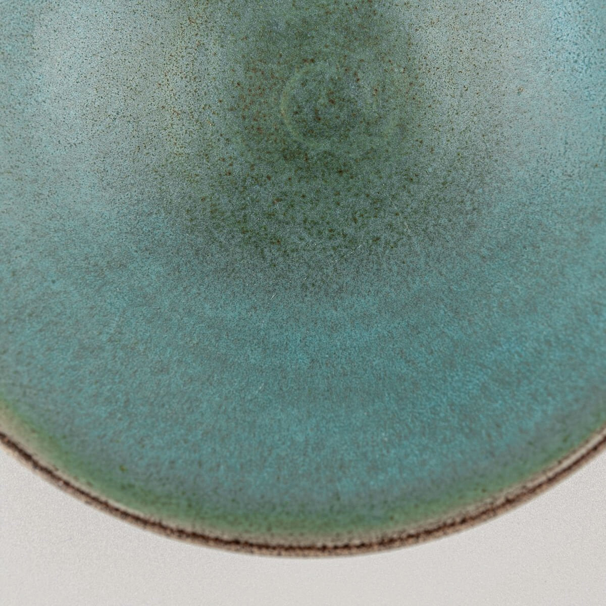 Zoom-in of rim and inner glaze showing subtle transitions of blue and green.