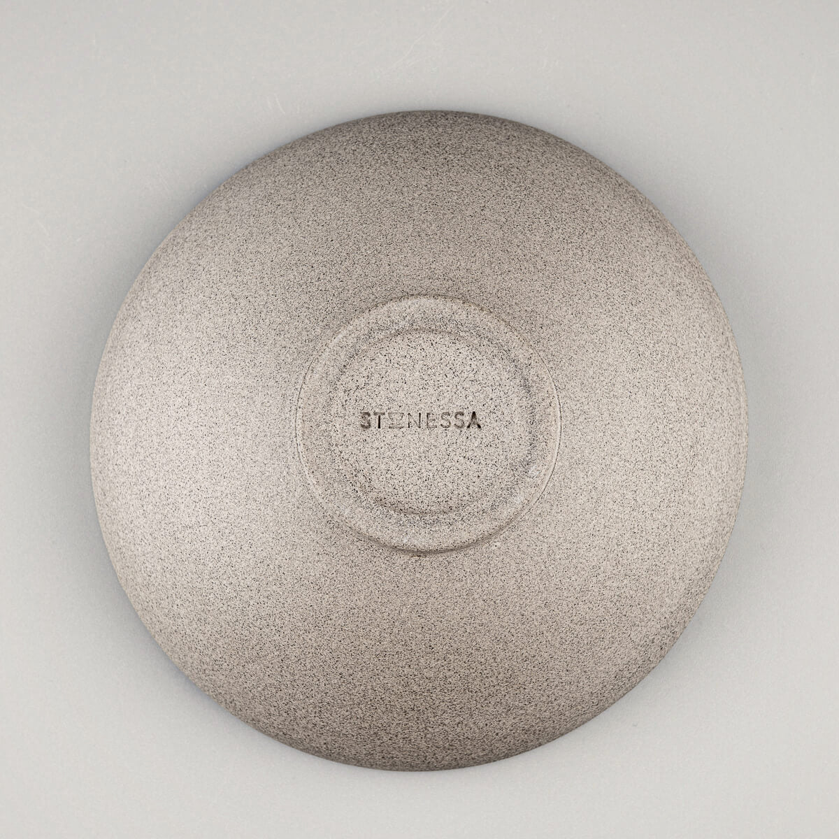 Bottom view of ceramic bowl showing circular foot and artisan craftsmanship.