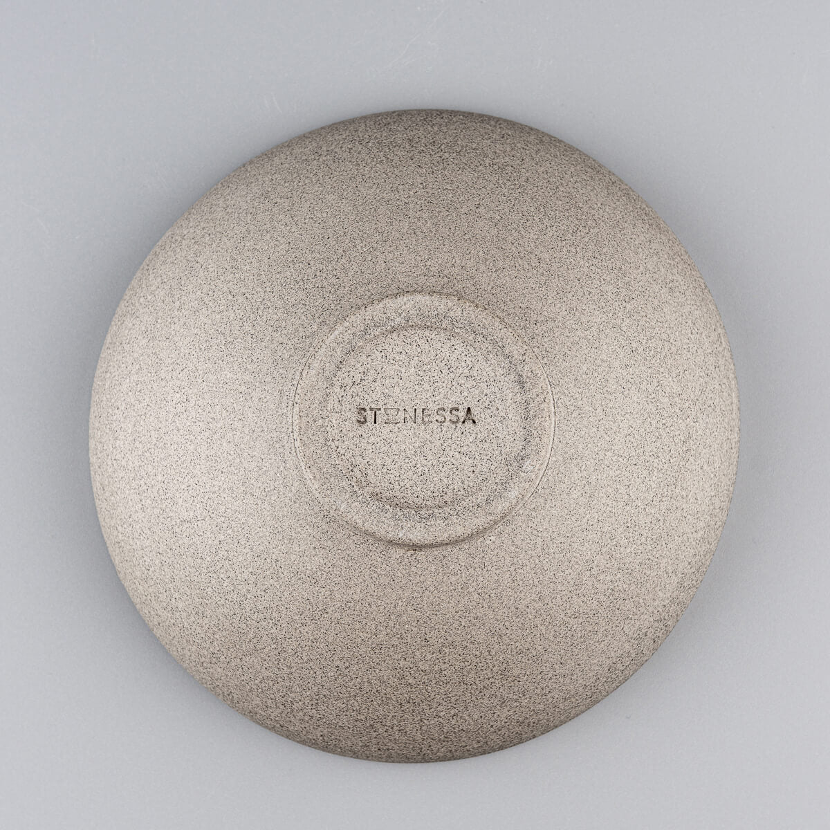 Bottom view of unglazed stoneware bowl showing signature pottery craftsmanship.