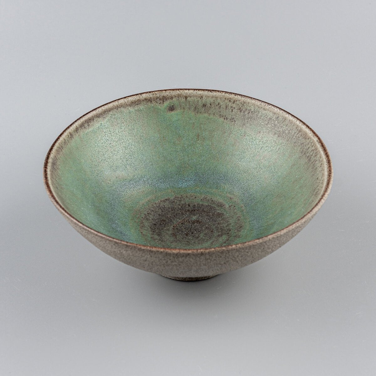 Stoneware bowl on display highlighting handcrafted ceramic artistry and minimalist design.