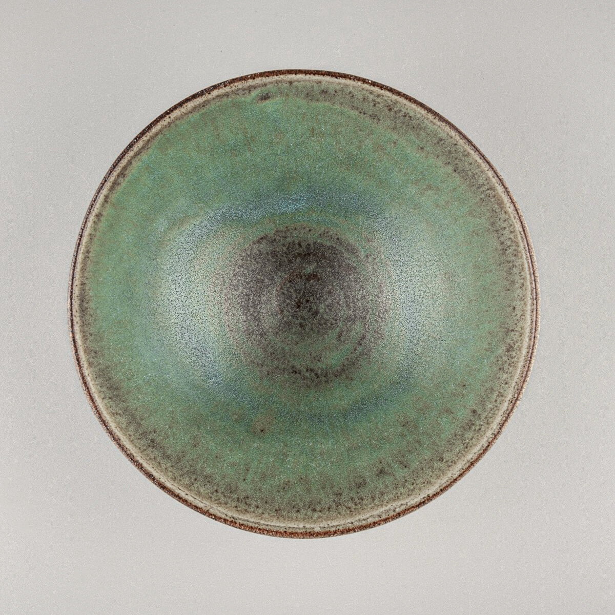 Stack of handcrafted ceramic bowls with fine dining aesthetics and collectible quality.