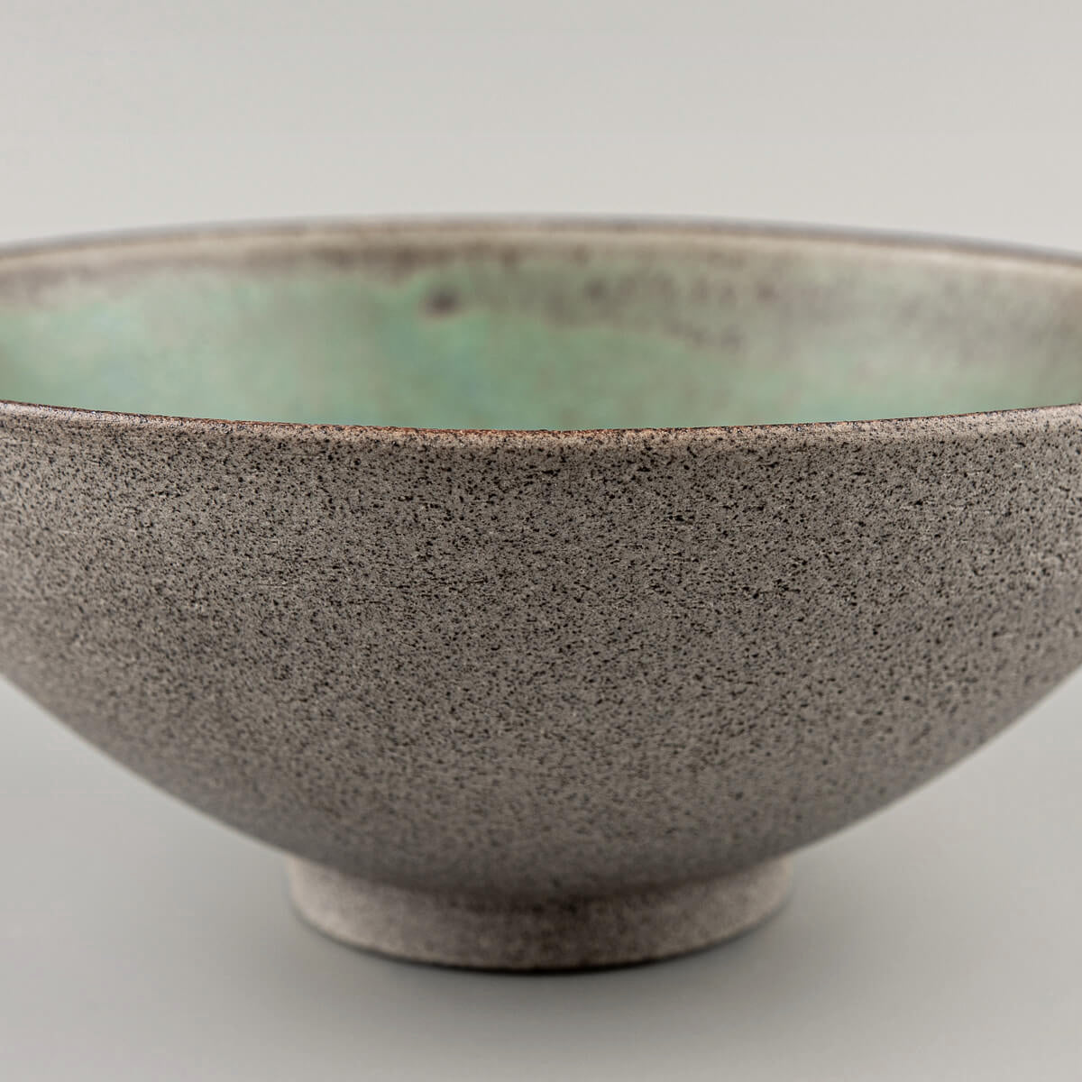 Close-up of bowl edge showing glaze finish and clay craftsmanship.