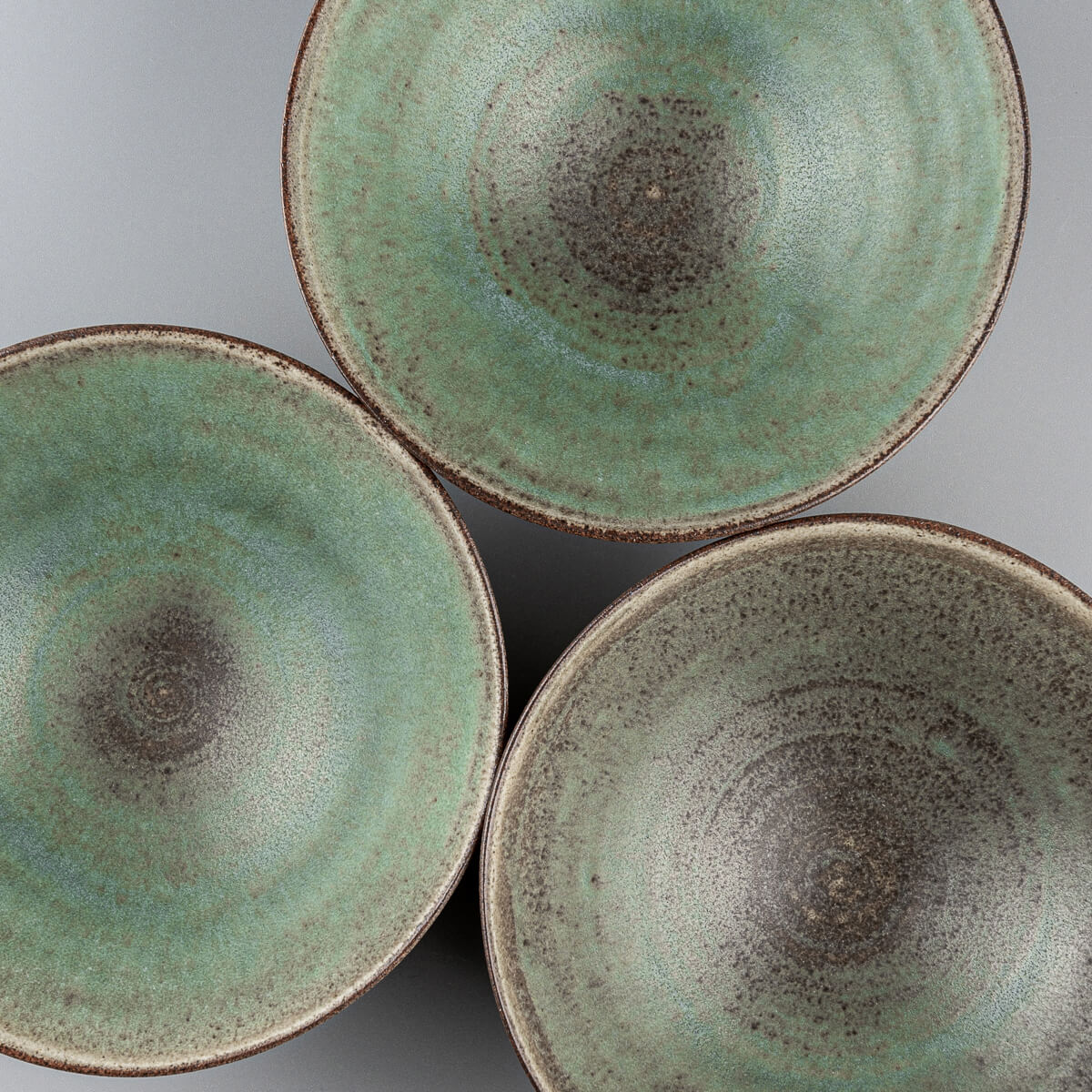 Set of handcrafted bowls ideal for boutique hotel or restaurant table settings.