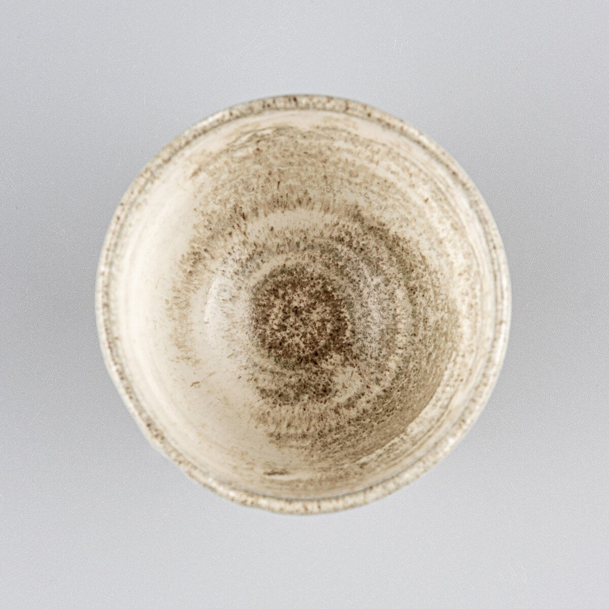Luxury ceramic mug with artistic glaze and textured stoneware finish for collectible pottery and interior design.
