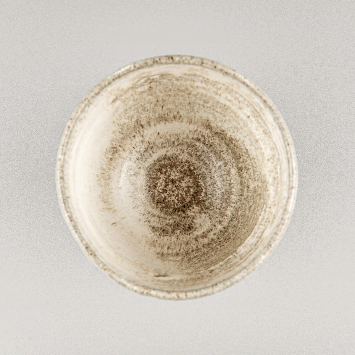 Luxury ceramic mug with artistic glaze and textured stoneware finish for collectible pottery and interior design.