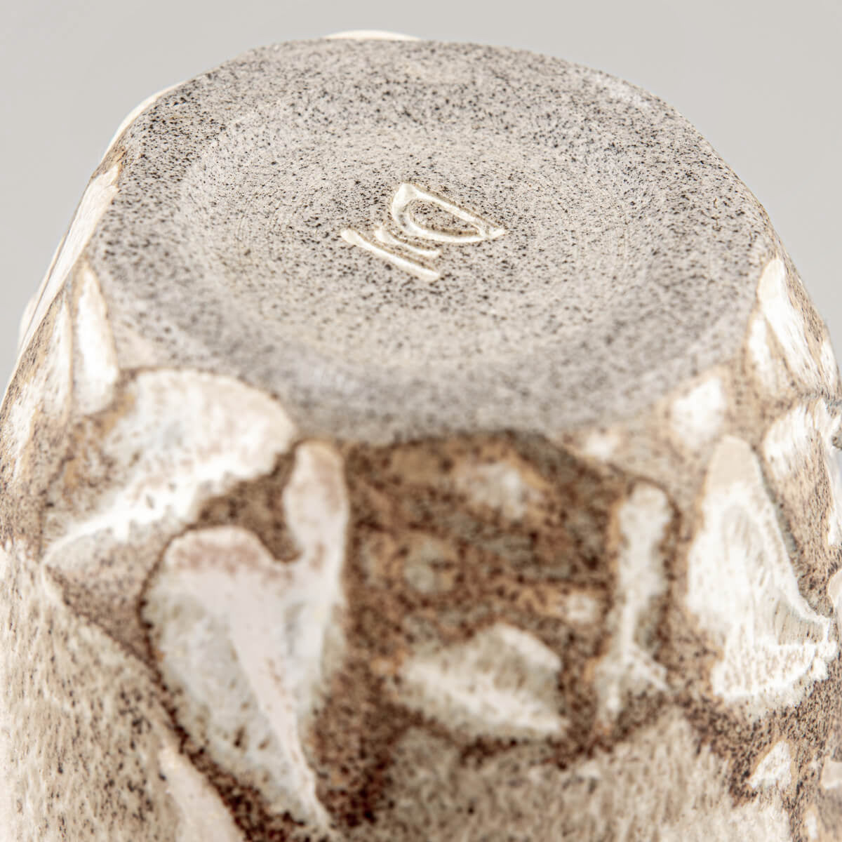 Stoneware ceramic mug with matte glaze and organic details, perfect for home, hotel, and handmade decor.