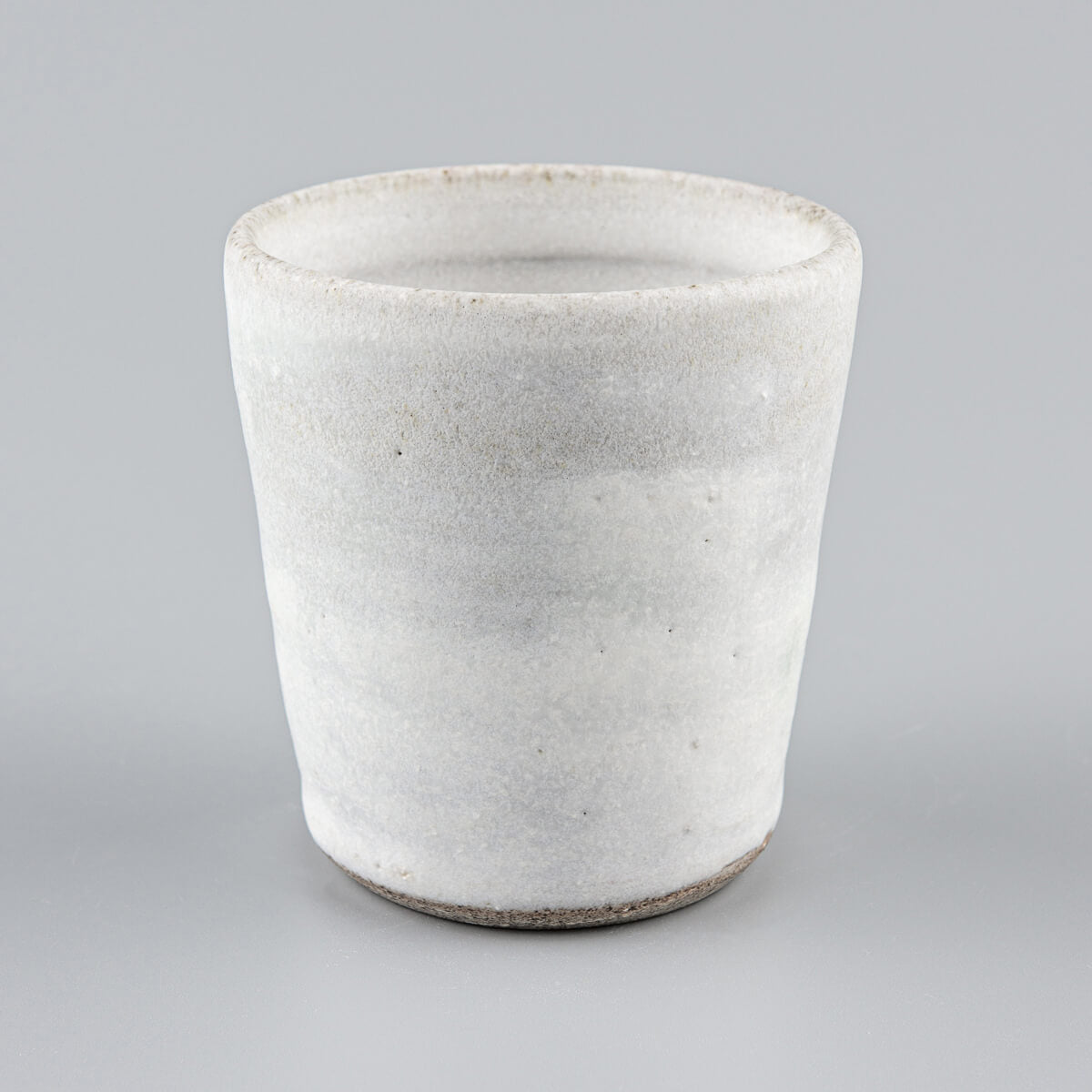 Handmade stoneware mug with white matte glaze for coffee, tea, and matcha tea rituals.