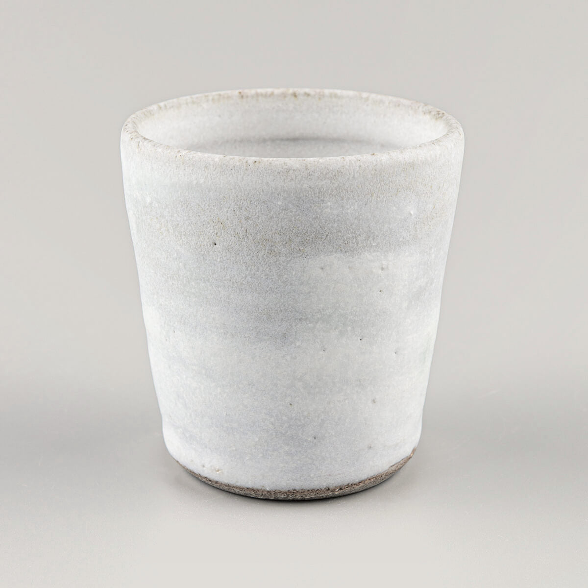 Handmade stoneware mug with white matte glaze for coffee, tea, and matcha tea rituals.