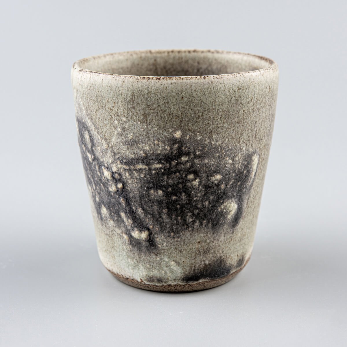 Interior view of pottery cup with unique glaze finish, crafted for culinary presentation and matcha tea rituals.
